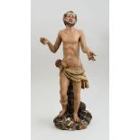 SPANISH BAROQUE CARVED AND PAINTED WOOD FIGURE OF A SAINT Modeled standing, wearing knotted loin