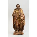 NEAPOLITAN CARVED, PAINTED AND PARCEL-GILT FIGURE OF AN APOSTLE The sandaled figure standing wearing