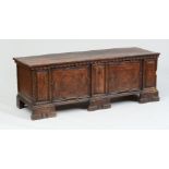 ITALIAN BAROQUE INLAID AND CARVED WALNUT CASSONE The hinged rectangular top with egg-and-dart border