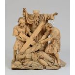GERMAN CARVED WOOD FIGURE GROUP Comprising the fallen Christ, a figure pulling at his robe,