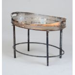 SILVER-PLATED OVAL TEA TRAY ON STAND With an oval pierced handled tray, raised on a silver-plated
