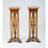 PAIR OF GEORGE IV PAINTED TORCHÈRES Each with a circular top raised on X-form supports centered by a