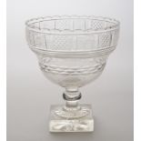 ANGLO-IRISH CUT-GLASS CENTERPIECE With an undulating rim and wasted bowl with geometric