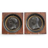 PAIR OF BRONZE-PATINATED METAL RELIEF PORTRAIT RONDELS The one titled Pascal, inscribed '1843'