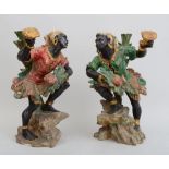 PAIR OF VENETIAN ROCOCO STYLE CARVED AND PAINTED WOOD BLACKMOOR FIGURES Each modeled as a barefoot