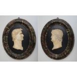 PAIR OF ITALIAN MARBLE PROFILE PORTRAITS OF ROMAN EMPERORS, TIBERIUS AND NERO Each within oval