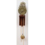 DUTCH BAROQUE BRASS PENDULUM CLOCK The 7 in. chapter ring with Roman numerals centering a subsidiary