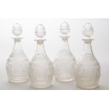 SET OF FOUR MOLDED GLASS DECANTERS AND STOPPERS From the Metropolitan Museum bookstore; each with an
