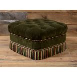 TUFTED UPHOLSTERED OTTOMAN Upholstered in olive green corduroy, with multicolored tasseled fringe.