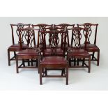 SET OF EIGHT GEORGE III STYLE MAHOGANY DINING CHAIRS Each with a serpentine top rail above the