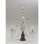 GEORGE III STYLE CUT-GLASS TWO-LIGHT CANDELABRUM The blue drum-form stem with gilt swags and oval