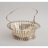 GEORGE II SILVER CAKE BASKET Maker's mark 'GS' in script, London, 1745; the pierced footed bowl with