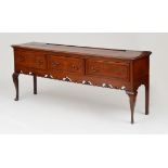 LATE GEORGE III OAK WELSH DRESSER BASE The rectangular top above three long drawers above a