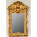 RARE GERMAN ROCOCO CARVED GILTWOOD MIRROR The rectangular mirror plate within an elaborate berried