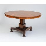 WILLIAM IV CARVED ROSEWOOD CENTER TABLE The circular top with apron, raised on a tripartite stem