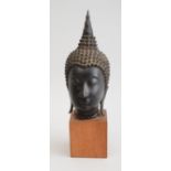 THAI BRONZE HEAD OF BUDDHA, IN THE SUKHOTHAI STYLE The head with tightly curled hair centering