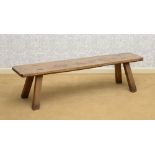 OAK PLANK BENCH, MODERN With a plank top with notched corners, raised on splayed rectangular legs.
