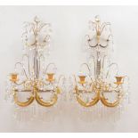 PAIR OF REGENCY GILT-METAL AND CUT-GLASS TWO-LIGHT WALL SCONCES Each with thumb-press triangular