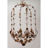 CONTINENTAL ROCOCO STYLE IRON AND TÔLE PEINT SIX-LIGHT CHANDELIER Of hexagonal cage-form with leaf-