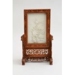 CHINESE BISQUE PORCELAIN PLAQUE IN CARVED HARDWOOD FRAME FORMING A TABLE SCREEN The plaque with