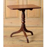 REGENCY MAHOGANY TRIPOD TABLE With a rectangular top raised on a turned stem on tripod base. 27 1/