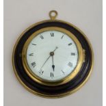 ENGLISH BRASS-MOUNTED EBONY WALL CLOCK The enamel dial with Roman numerals, within molded case. 7