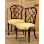 PAIR GEORGE III MAHOGANY SIDE CHAIRS Each with incurved fretwork back splats, above the serpentine-