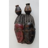 SENUFO CARVED AND PAINTED WOOD DOUBLE FACE MASK With almond-shape red/black face, beneath braided