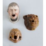 GROUP OF THREE ENGLISH POTTERY MASK HEAD INKWELLS