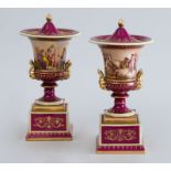 PAIR OF VIENNA PORCELAIN PICTORIAL CAMPANI-FORM URNS AND COVERS