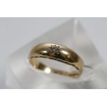 A gold ring inset with a solitaire diamond