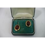 A pair of 18ct gold and coral ear rings.