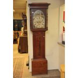 A mahogany 8 day long case clock, the arched dial
