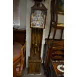 A reproduction long case clock.