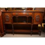 A chiffonier with carved doors