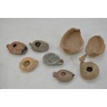 Seven possibly ancient Egyptian oil lamps.