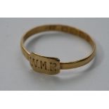 A 22ct gold ring monogrammed WMR.