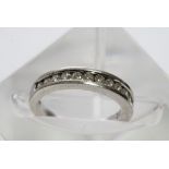 A 9ct white gold half hoop eternity ring with a si