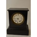 A Late Victorian black slate mantel clock with an