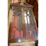 An Edwardian mahogany hanging display cabinet, the