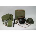 A collection of old army bags, bayonet, helmet etc