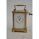 A brass cased carriage clock.