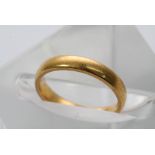 A 22ct gold wedding band ring