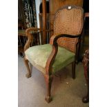 A small oak desk, a chair with an upholstered seat