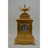 A French mantel clock the gilded case decorated wi