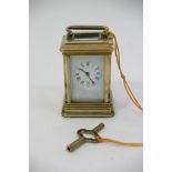 A small brass carriage clock.