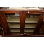 An Oak Open Bookcase with a pair of glazed doors