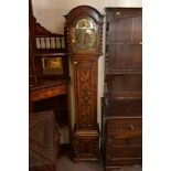 An oak longcase clock