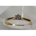 An 18ct gold diamond solitaire ring, the diamond a