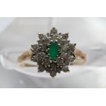 A 9ct gold ring set with an emerald and cz cluster